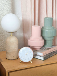 Maisie Silent Tick Alarm Clock blush vintage style with gold accents on wooden bedside table