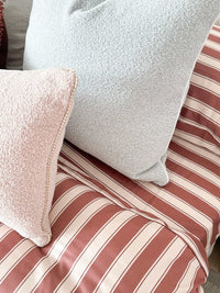 Mulberry Threads Cinnamon Stripe bamboo sheet set with warm cinnamon and shell stripes on bed
