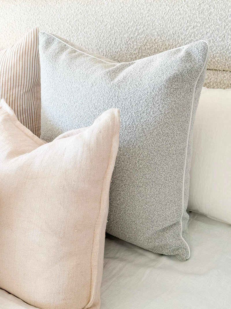 norsu Studio Cushion in powder blue boucle with white leather piping, handcrafted luxury, various sizes