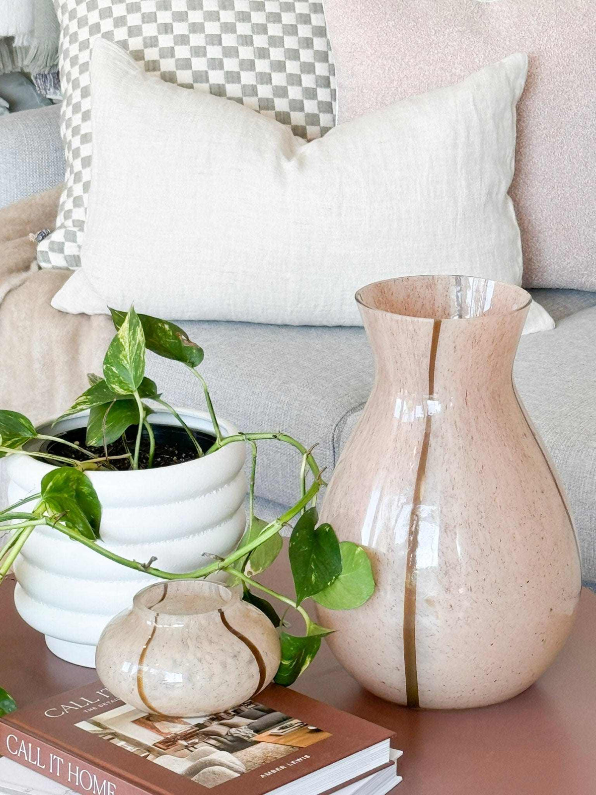 GlobeWestBoden Stripe blush tall glass vase with delicate stripe pattern on table next to plant and small vase