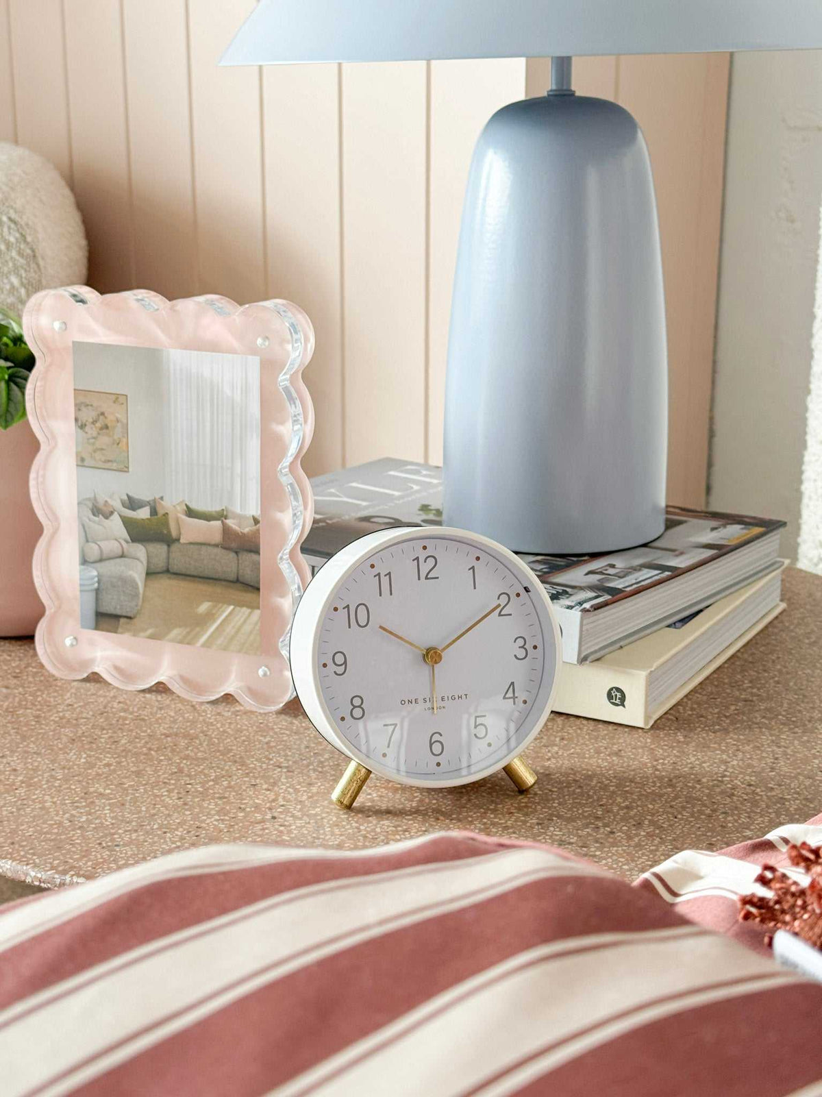 Maisie Silent Tick Alarm Clock in white with gold accents on bedside table