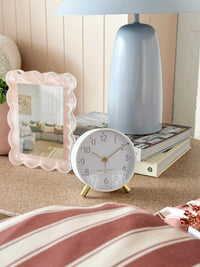 Maisie Silent Tick Alarm Clock in white with gold accents on bedside table