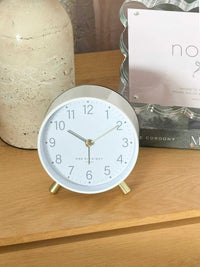 Maisie Silent Tick Alarm Clock white with gold accents vintage design on wooden surface