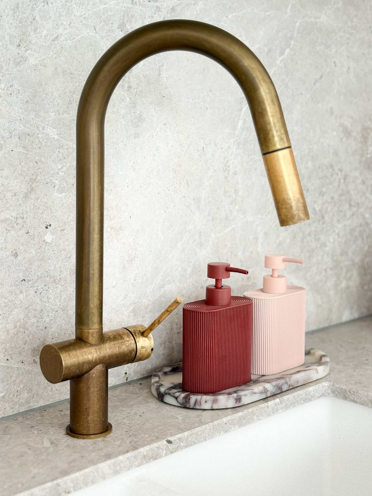 Rose-colored Rosie Resin Dispenser made of durable resin with ridged grip for kitchen or bathroom use