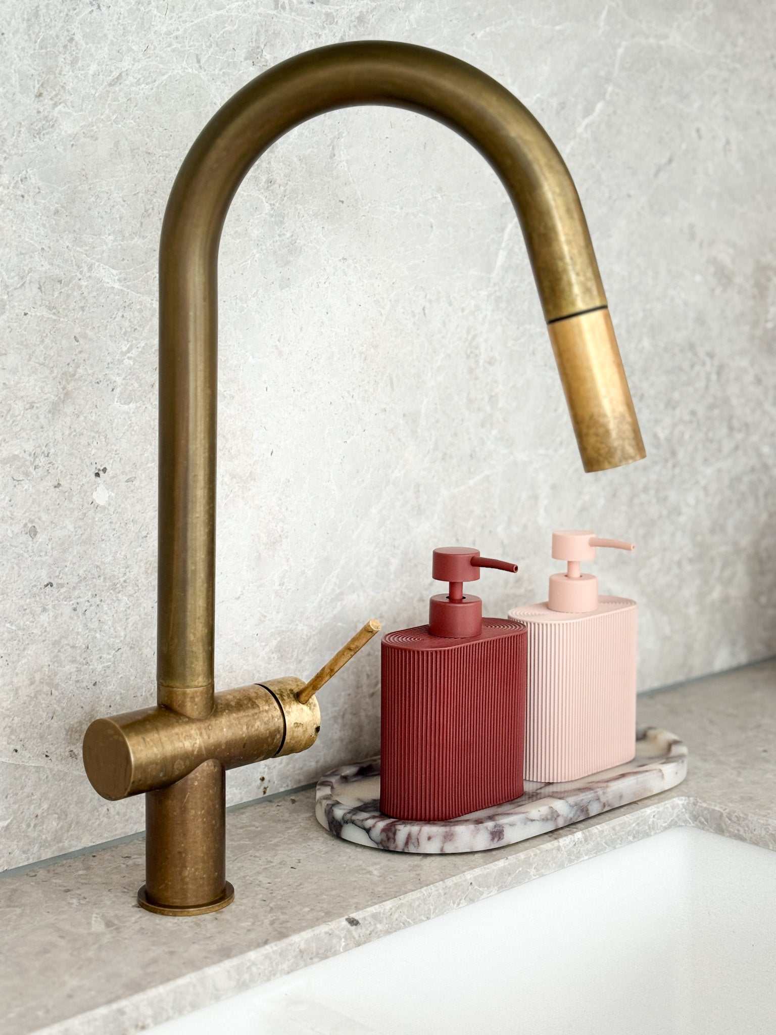 Rose-colored Rosie Resin Dispenser made of durable resin with ridged grip for kitchen or bathroom use