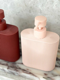 Rosie resin dispenser in rose color with ridged grip, durable and refillable for kitchen or bathroom use