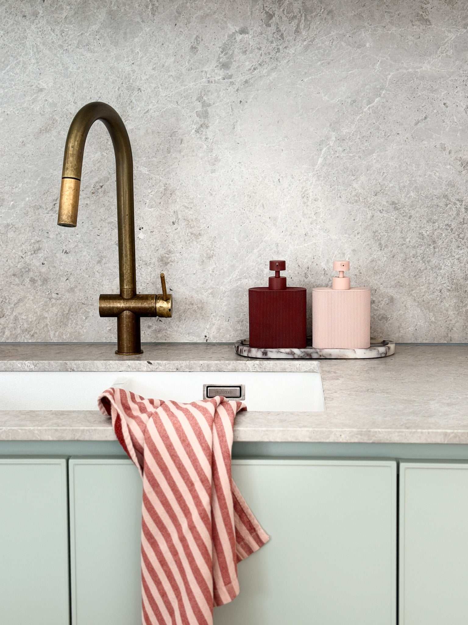 Rose-colored Rosie Resin Dispenser made of durable resin with ridged grip for kitchen or bathroom use