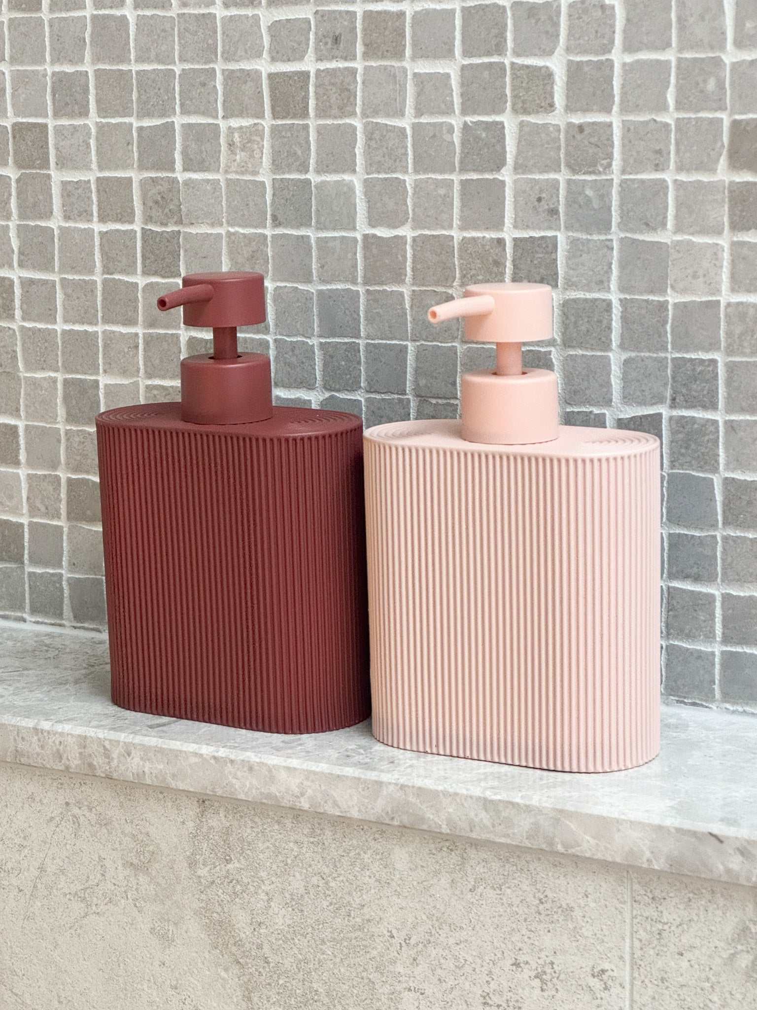 Rose-colored Sid Resin Dispenser with ridged grip for kitchen or bathroom use