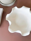 Lottie Decorative Bowl white ceramic with ruffled edge and matte finish on table