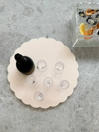 norsu Studio Spin Me Round blush scalloped acrylic lazy susan with smooth rotating base in two sizes
