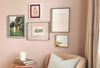 In This Moment Print digital downloadable art displayed on a pink wall in a cozy living room setting.