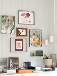Wall art gallery featuring Her Print digital download framed among other artworks in a stylish living space