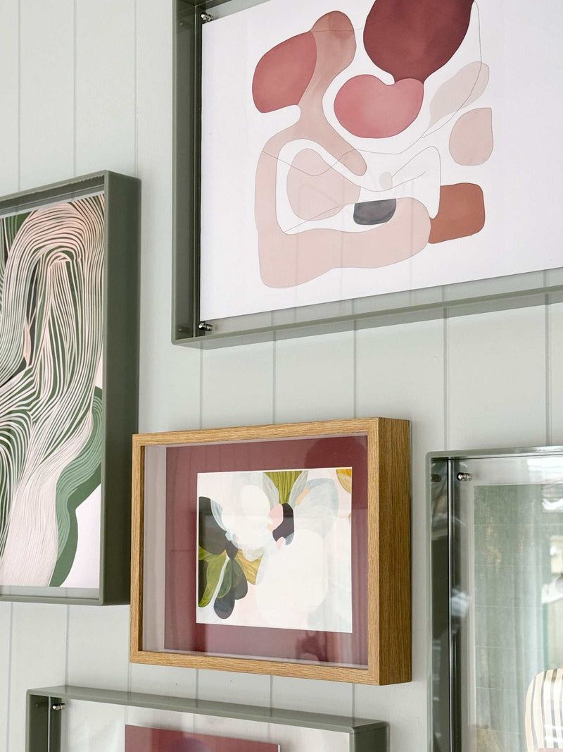 Shadow Box A4 Frame oak wood with perspex front displaying abstract art, hung on a wall in portrait orientation