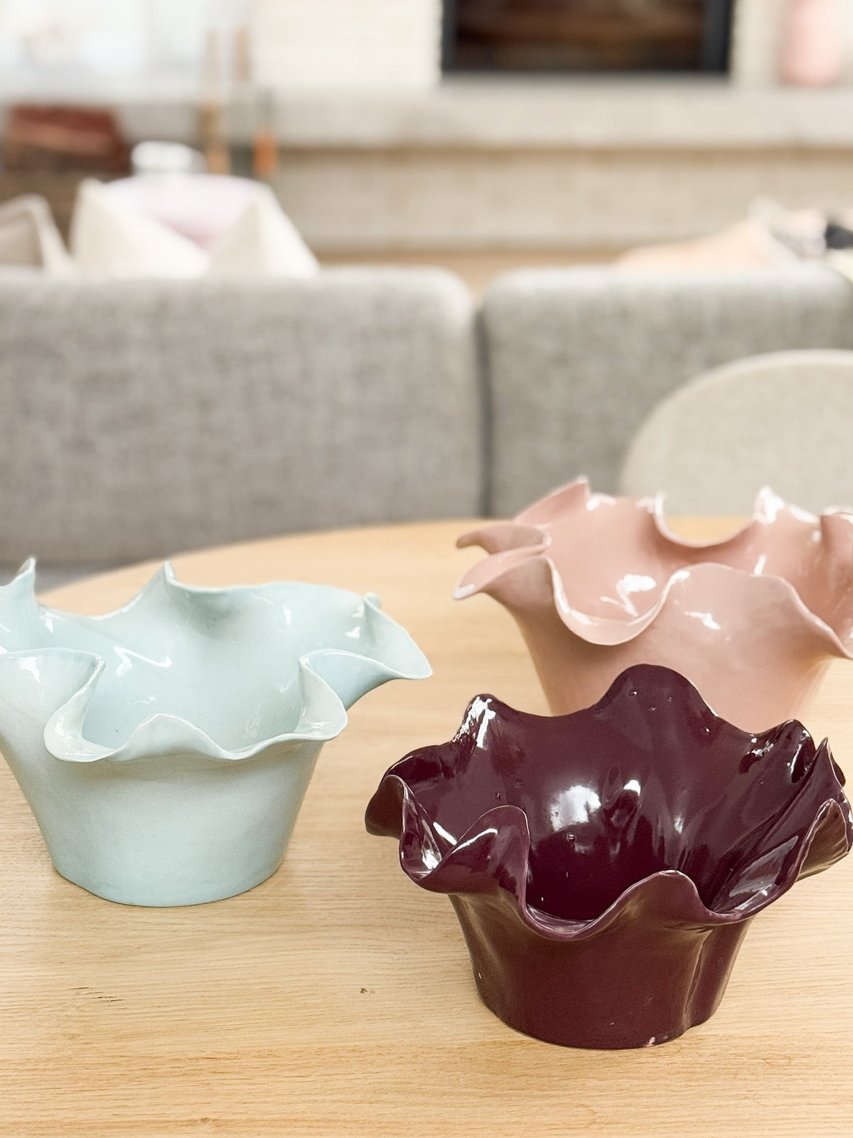 norsu Studio Flow sculptural ceramic bowl in burgundy with ruffled edges and glossy finish