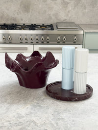 norsu Studio Flow sculptural ceramic bowl in burgundy with ruffled edge and glossy finish
