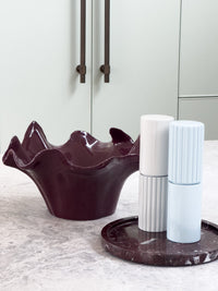 norsu Studio Flow sculptural ceramic bowl with burgundy glaze and organic ruffled edge