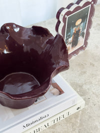 norsu Studio Flow sculptural ceramic bowl in burgundy with organic ruffled edges and glossy finish
