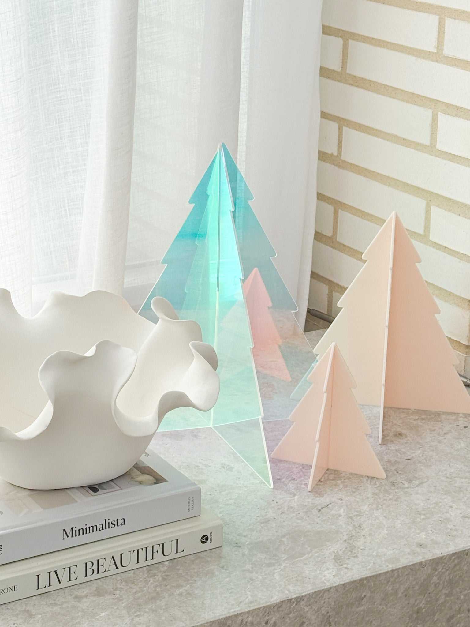 norsu Studio Perspex standing Christmas trees set of 3 in mixed pastel colors on marble surface