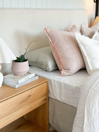 Ivory norsu Cabin Bedhead in king size with textured Ovis boucle fabric and self-piped trim, styled with neutral pillows and modern bedroom decor