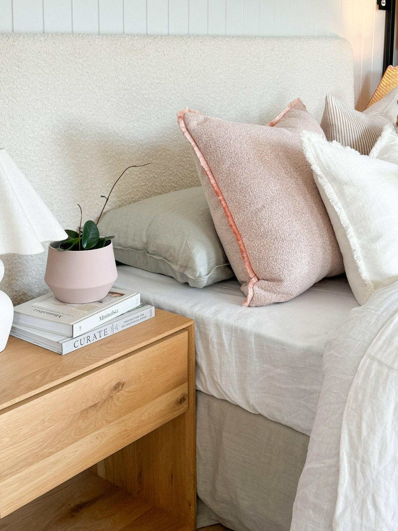 Ivory norsu Cabin Bedhead in king size with textured Ovis boucle fabric and self-piped trim, styled with neutral pillows and modern bedroom decor