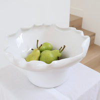 norsu Studio Flow white sculptural ceramic pedestal fruit bowl with ruffled edge and blush glaze