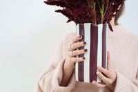 norsu Studio Flow handpainted ceramic vase with burgundy and soft blue stripes, scalloped petal rim, small sculptural design