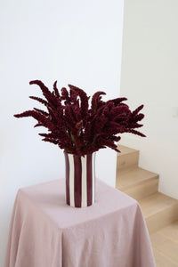 norsu Studio Petal Handpainted Ceramic Vase with scalloped petal rim in burgundy and soft blue wash stripe glaze