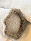 Maxima Bolster Cushion in stone color with textured fabric and fringe detailing from norsu STUDIO Forma Collection
