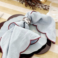 Set of 4 norsu Studio linen napkins in blue with deep burgundy scalloped edges, 50x50 cm, soft 100% linen fabric.