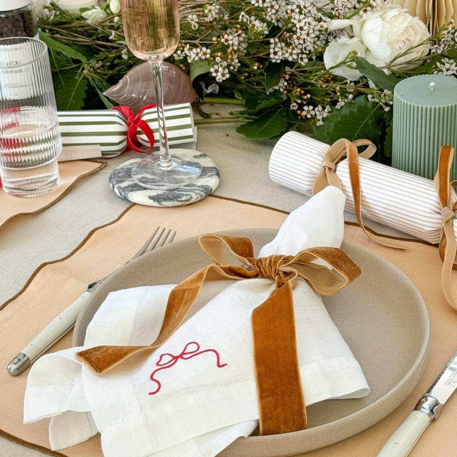 Same Time Tomorrow caramel velvet bow napkin ring on white napkin with elegant table setting