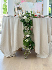 L&M Terrace Oatmeal Tablecloth in soft linen-cotton blend with elegant floral table decoration