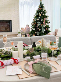 L&M Terrace Oatmeal Tablecloth with elegant Christmas table setting and festive decorations