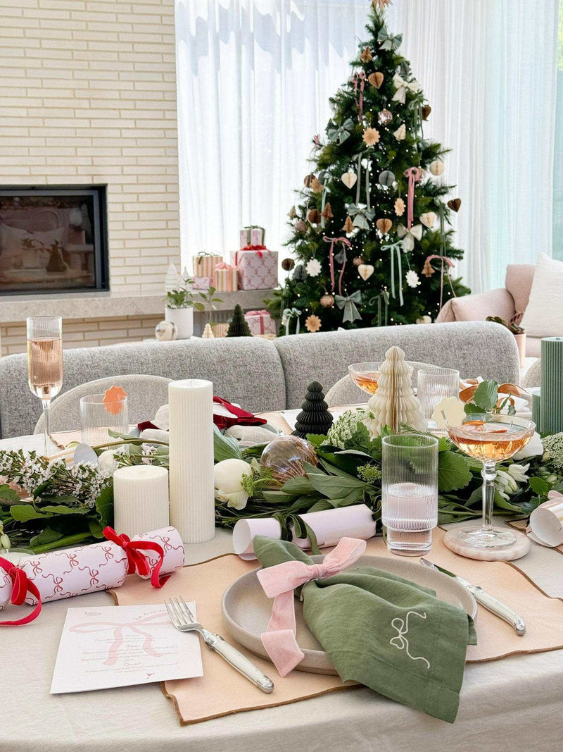 L&M Terrace Oatmeal Tablecloth with elegant Christmas table setting and festive decorations