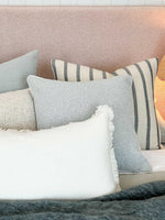 Eadie Lifestyle Luca white boho cushion with hand-frayed edging in various sizes on a sofa setting