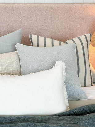 Eadie Lifestyle Luca white boho cushion with hand-frayed edging in various sizes on a sofa setting