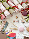 norsu Studio build your own Christmas crackers set with velvet ribbons, gifts, puzzles, and festive decorations