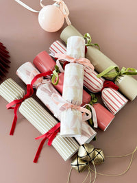 Set of 6 norsu Studio Build Your Own Christmas Crackers with velvet ribbons and festive designs
