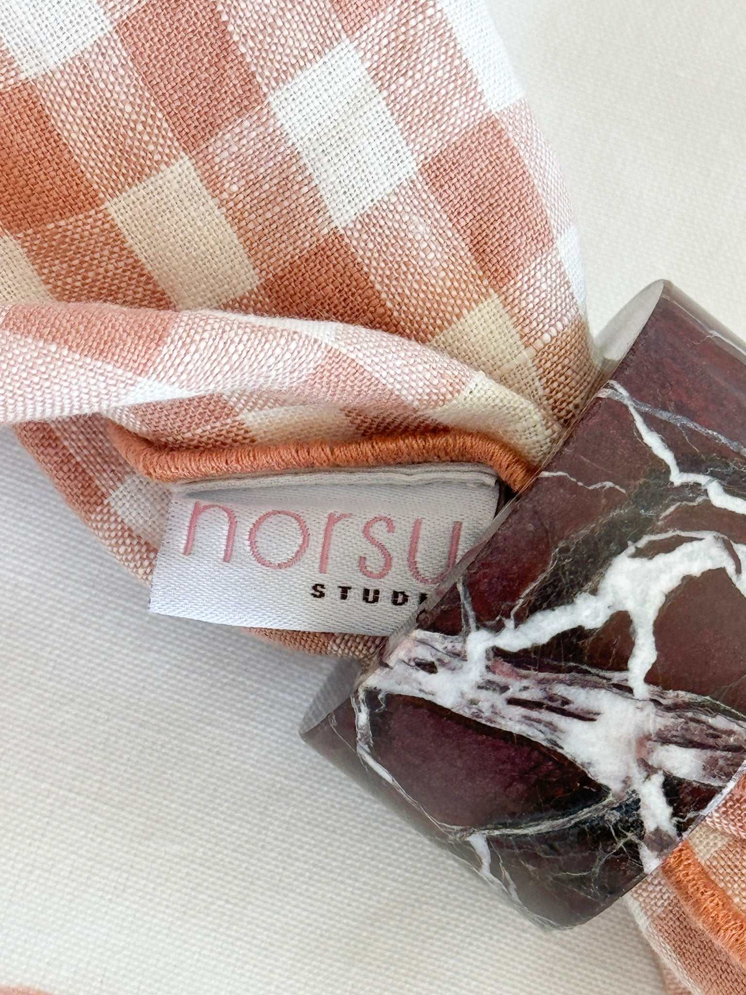 Set of 4 norsu STUDIO Marble Circular Napkin Rings in Rosso Levanto with deep burgundy tone and natural white veining