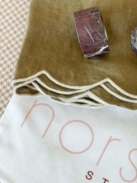 norsu Studio Linen olive scallop-edged napkin with oatmeal edge set of 4 and fabric storage bag