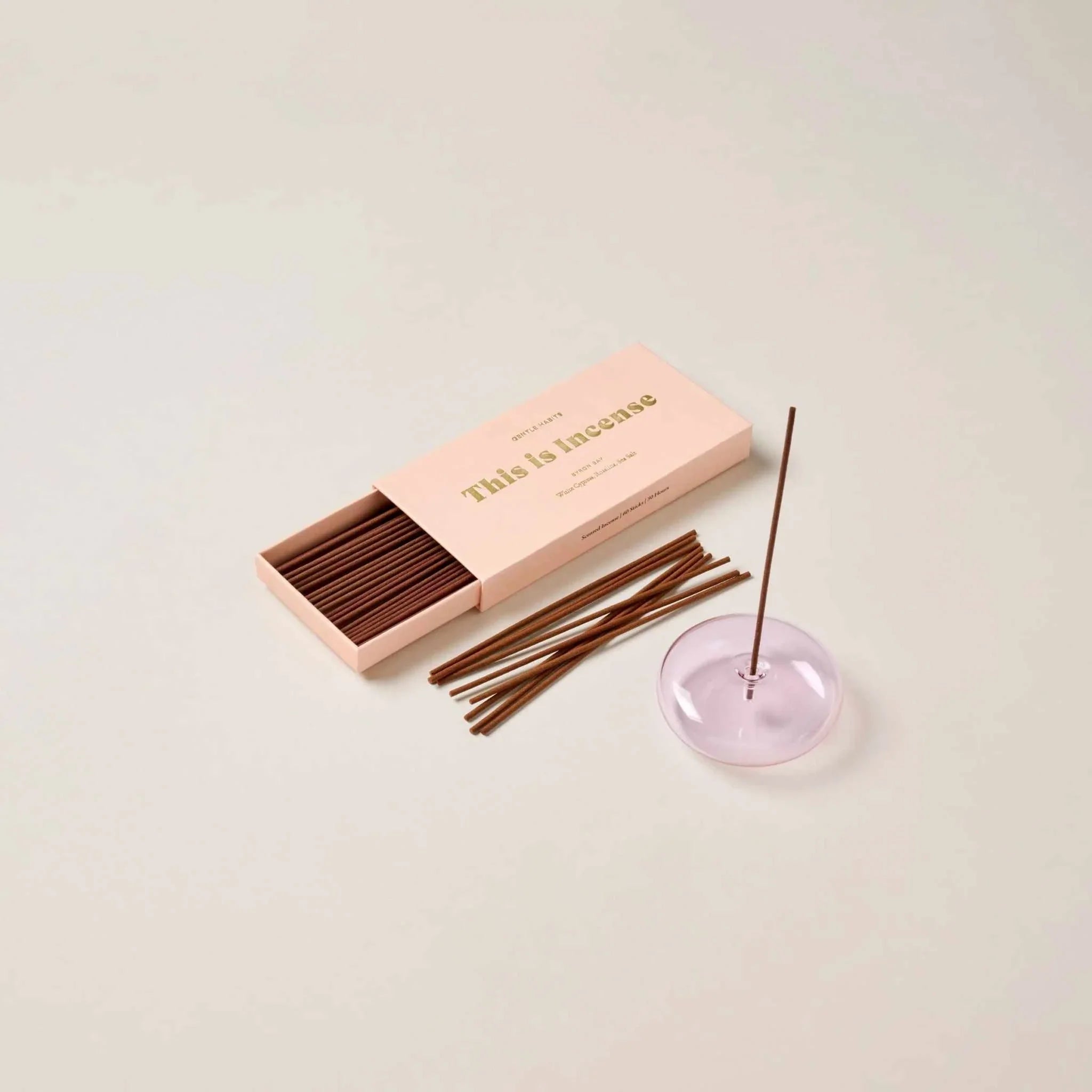 Gentle Habits Incense Byron Bay with cedarwood and citrus scent sticks in pink box and holder.