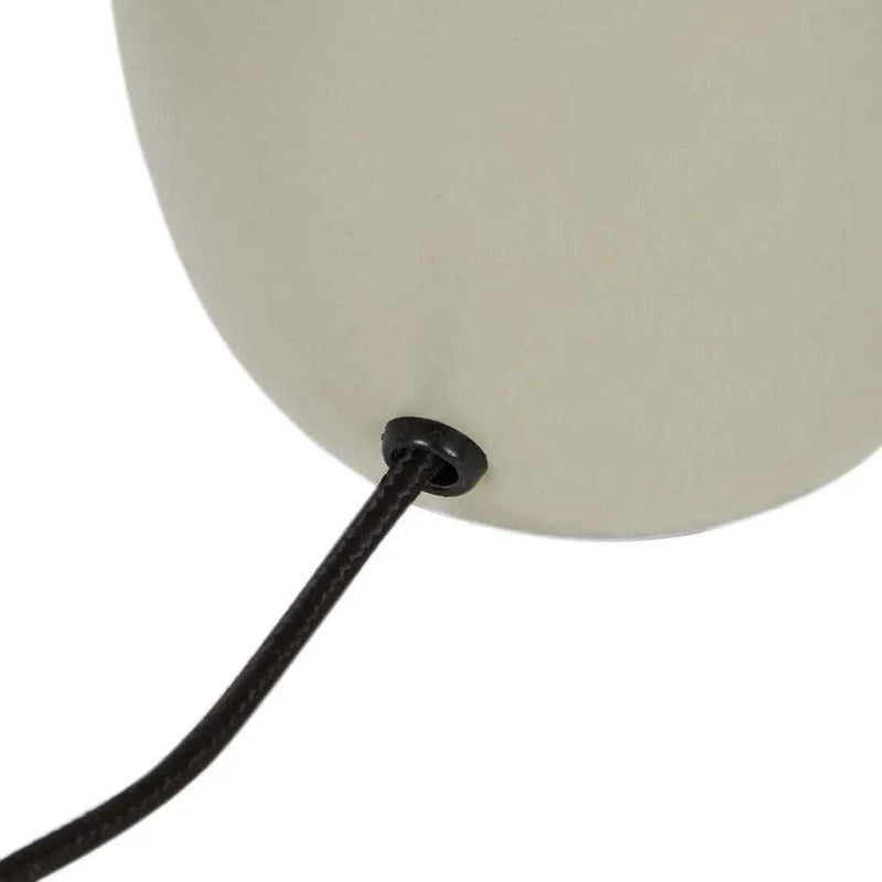 Close-up of Easton Curve Lamp featuring a soft curved shade and black fabric cord with iron base in Pantone Elm finish.