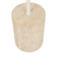 Close-up of the natural travertine base of the Easton Marquee Floor Lamp in matt ivory finish