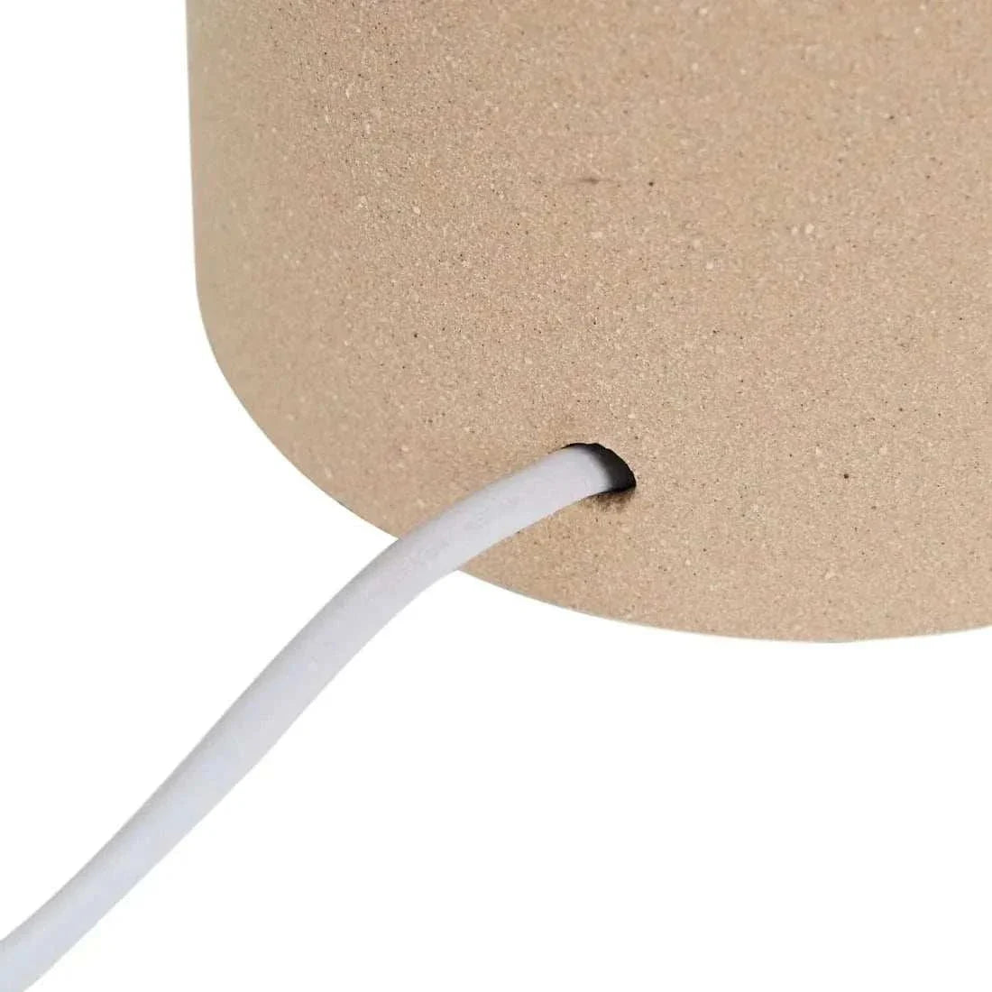 Close-up of Globe West Lorne Canopy Lamp base in textured sand with white cord detail