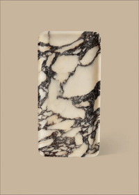 Linea Rectangle Marble Tray made of Calacatta Viola marble with black veins on a beige background