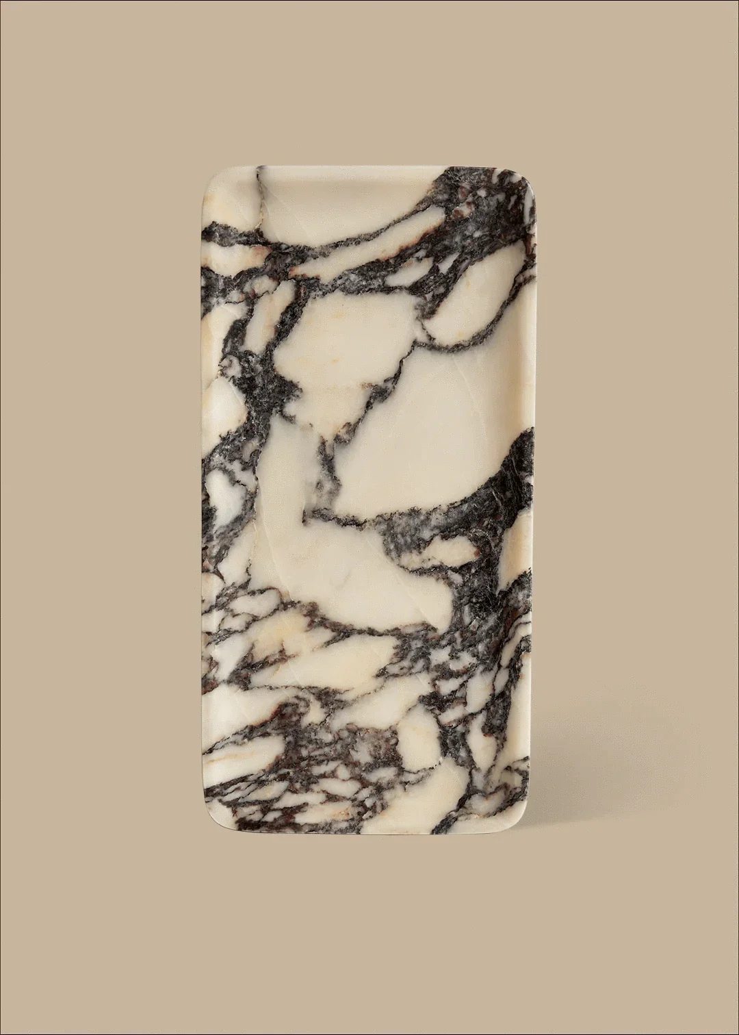 Linea Rectangle Marble Tray made of Calacatta Viola marble with black veins on a beige background