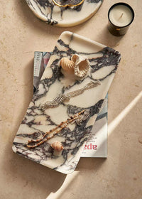 Linea Rectangle Marble Tray in Calacatta Viola with violet veins, used to organize jewelry and decorative items
