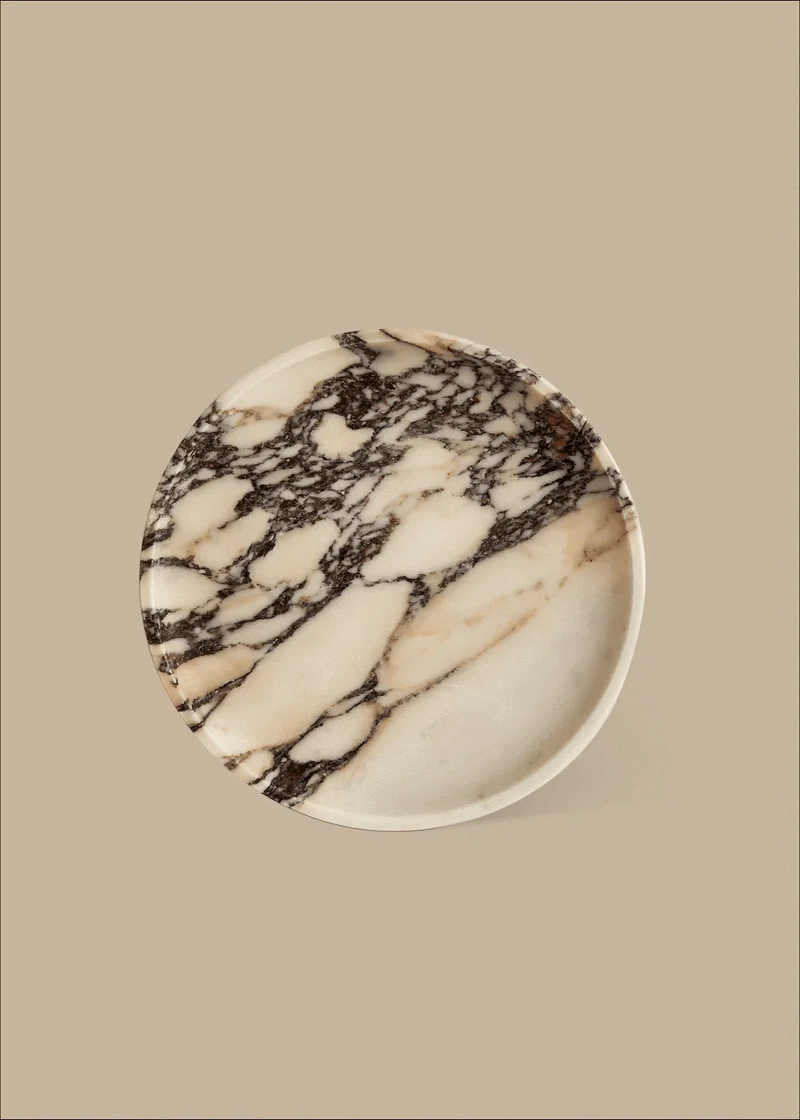 Round Linea marble tray with Calacatta Viola stone and violet veins on beige background