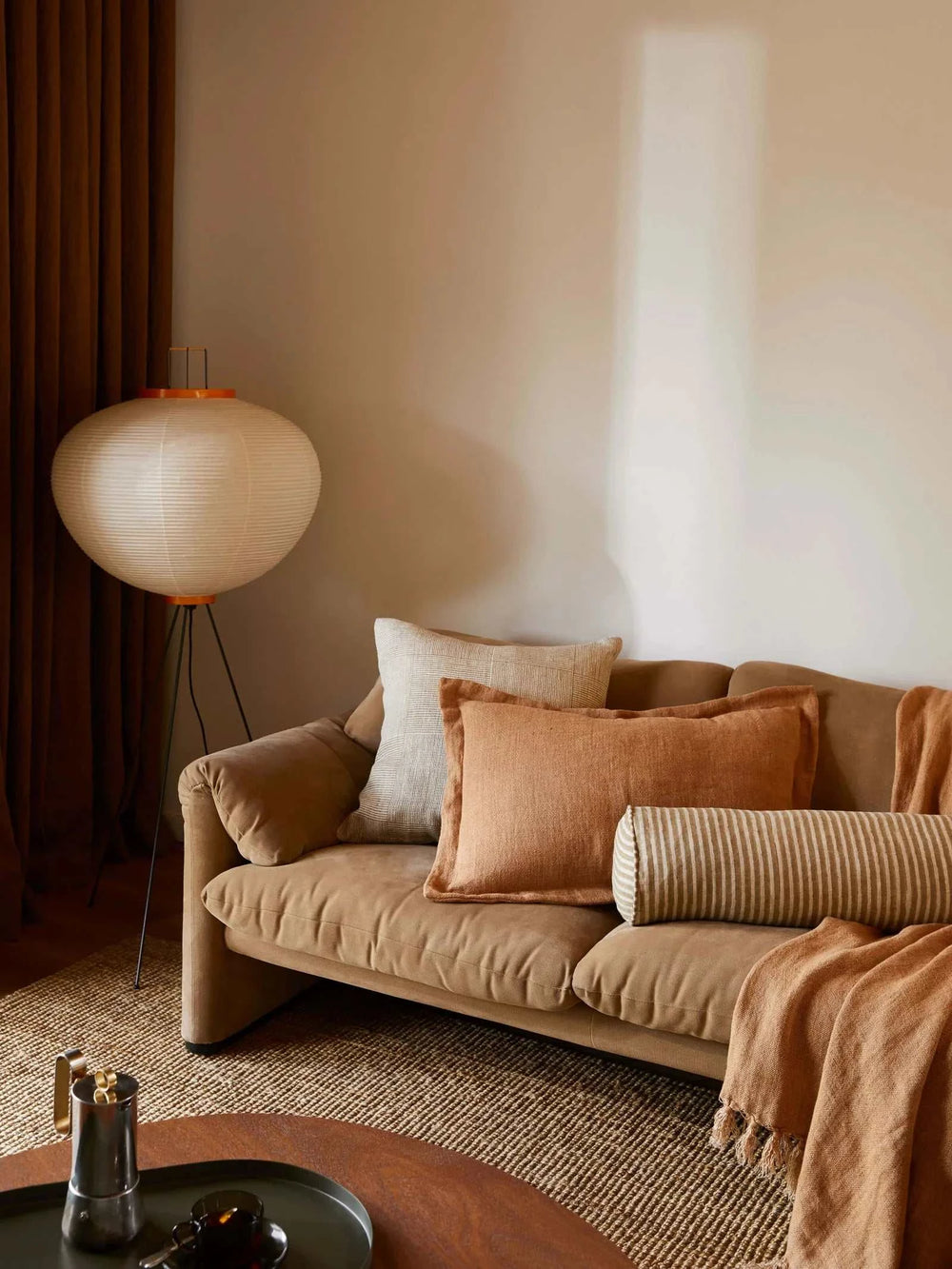 Vida Linen Cushion in khaki with woven check texture on sofa in cozy living room setting