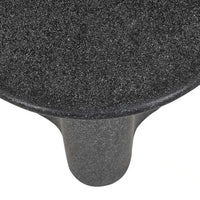Close-up of Globe West Artie Outdoor Wave Side Table in black speckle fibrestone with wave design top and sturdy base