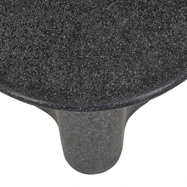 Close-up of Globe West Artie Outdoor Wave Side Table in black speckle fibrestone with wave design top and sturdy base